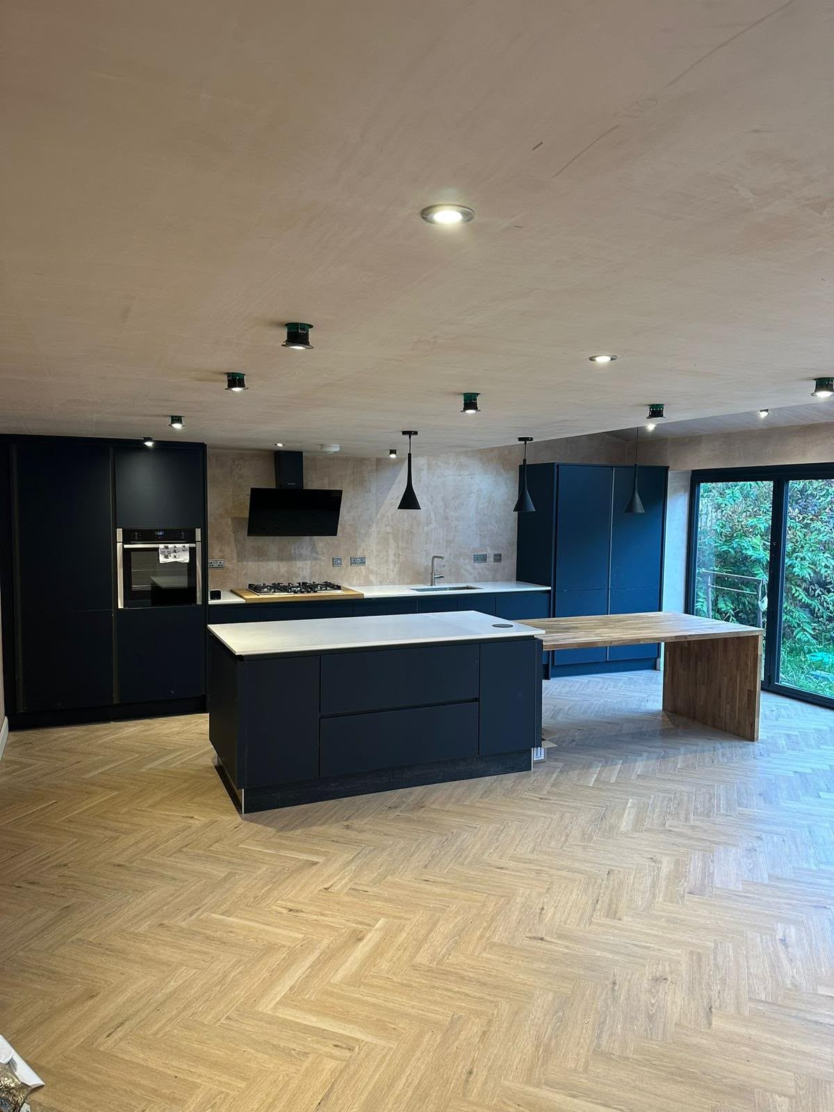 Contemporary dark kitchen and island