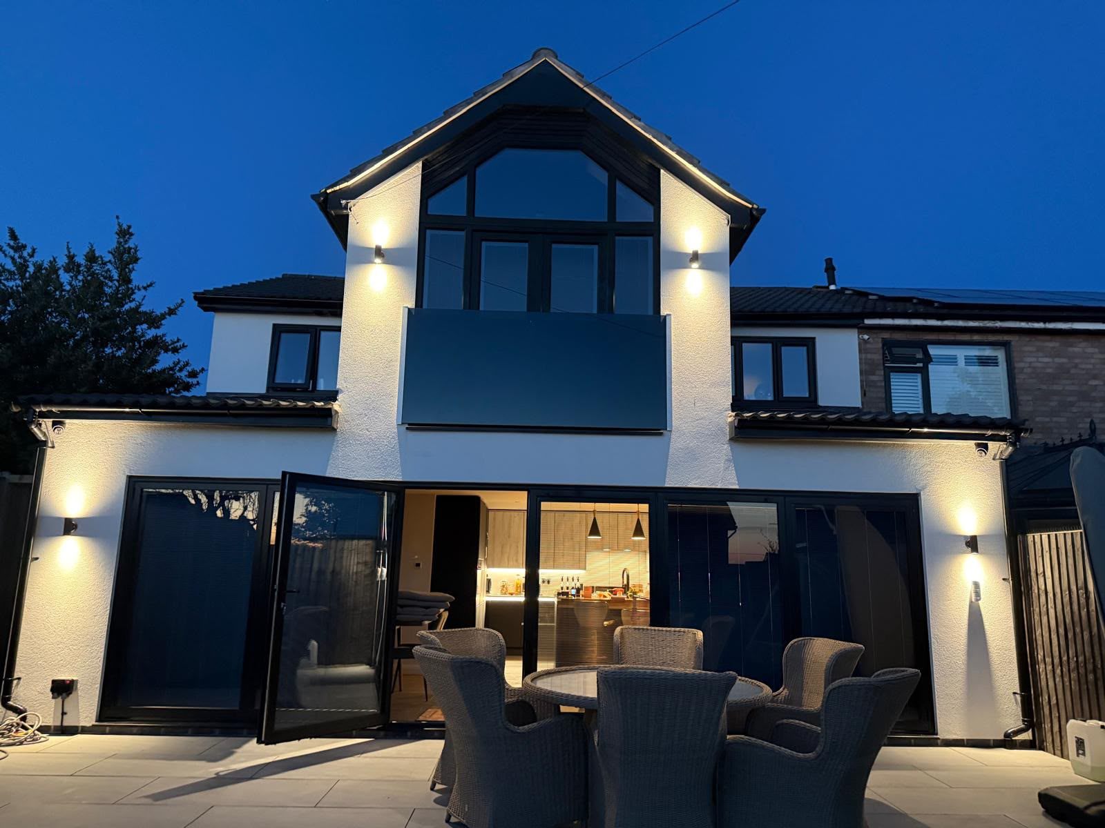 Completed rear extension illuminated at dusk