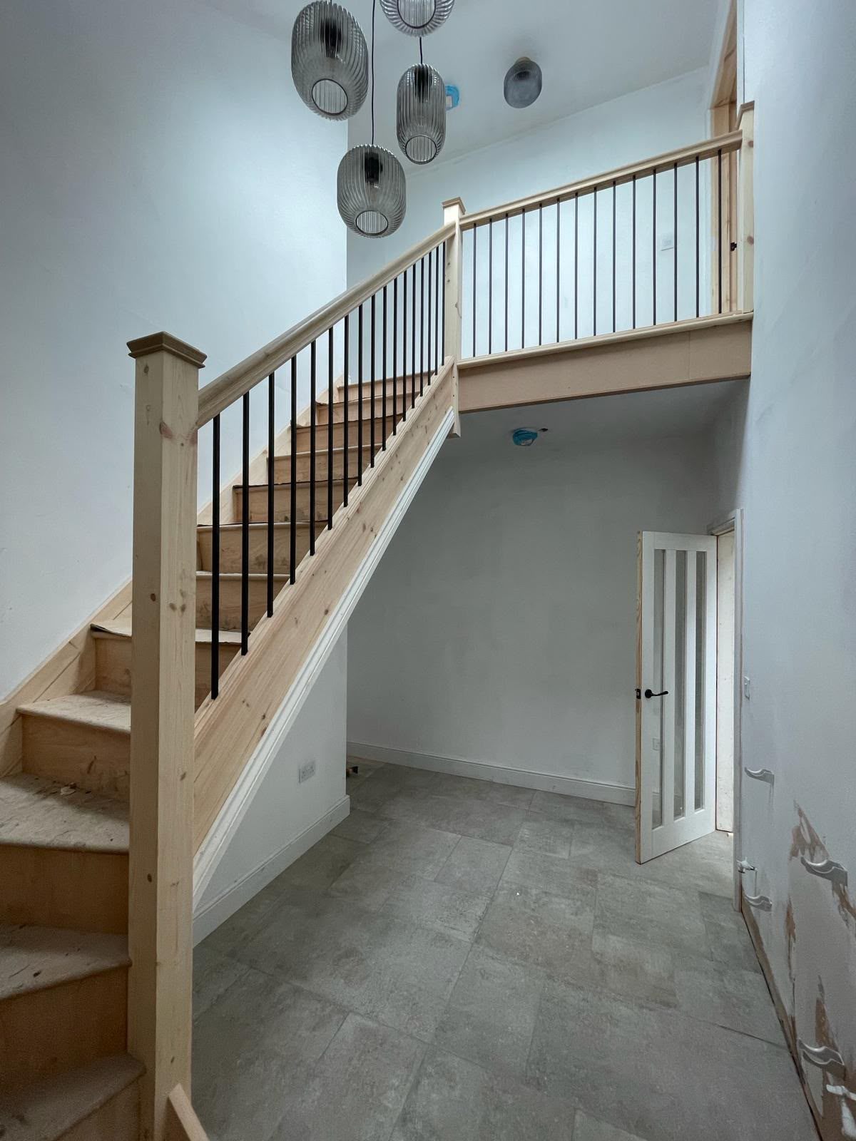 Double-height hallway and feature staircase